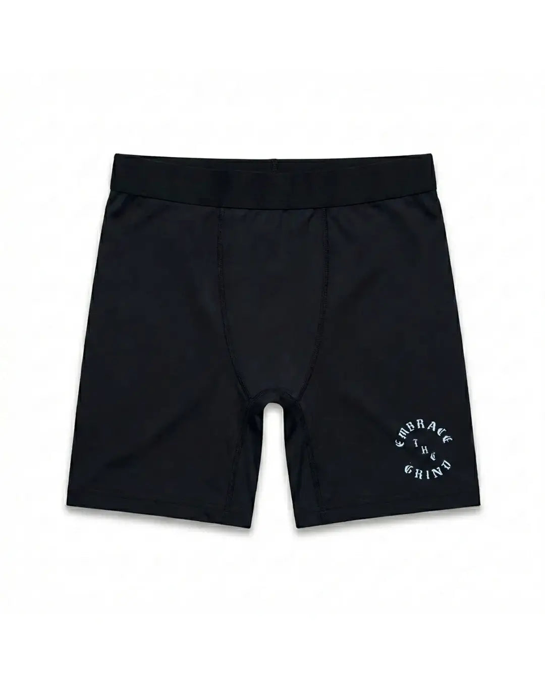 Black compression shorts for MMA and BJJ — front flat lay