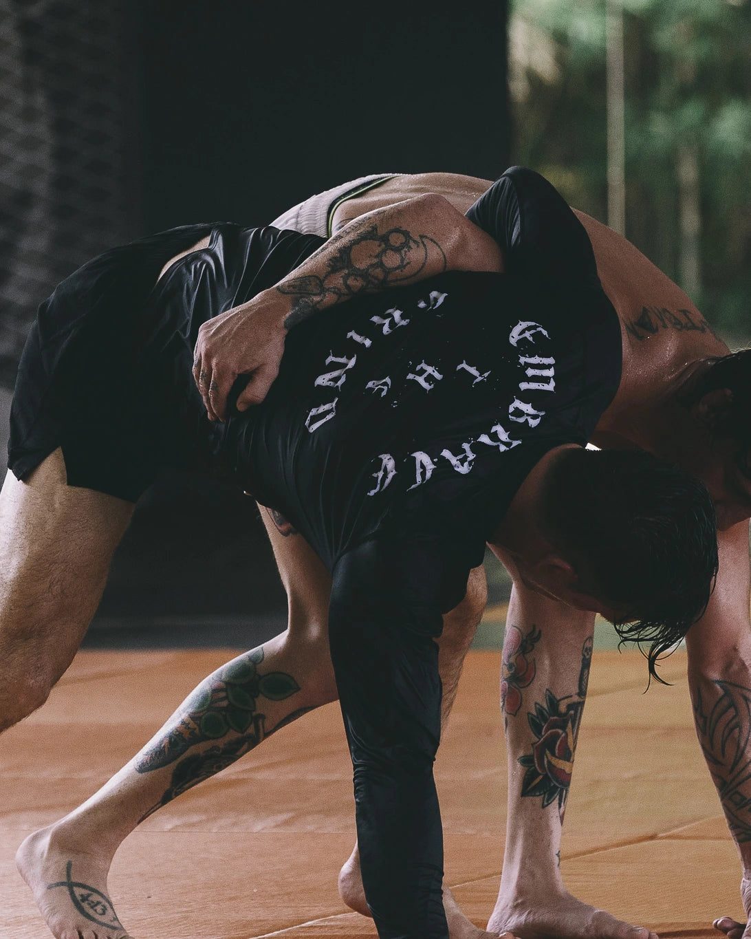 Athlete wearing long sleeve rashguard V2 during grappling training