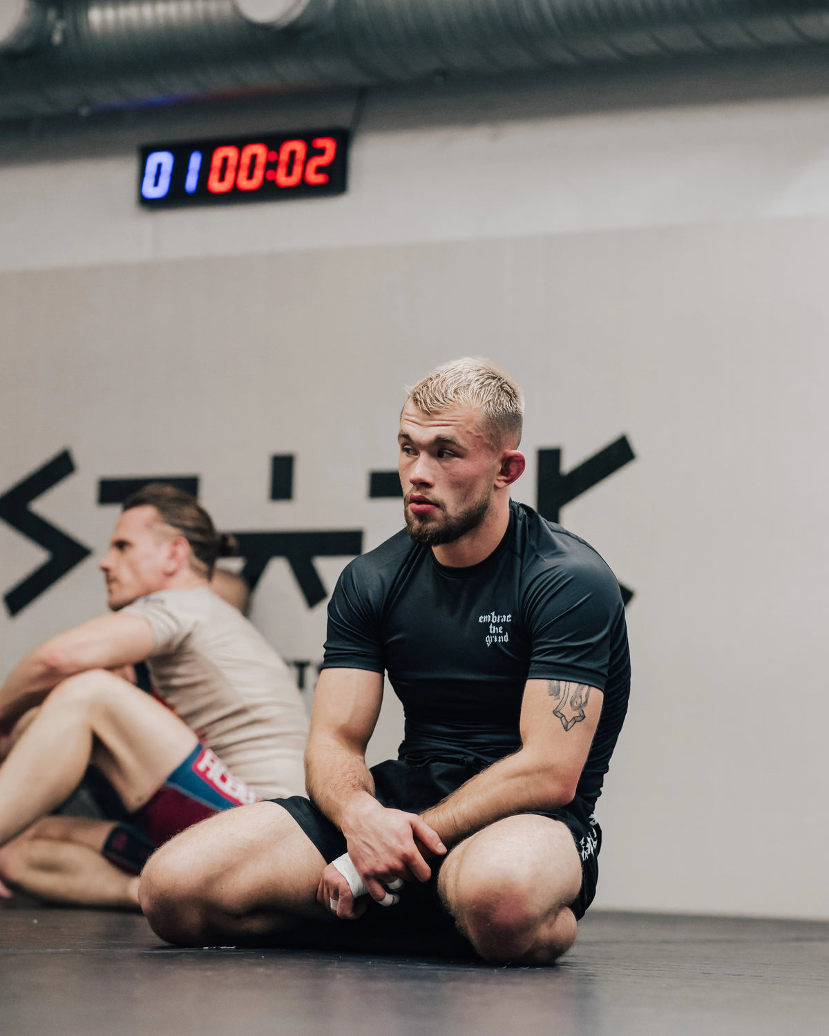 Athlete wearing short sleeve rashguard during BJJ training